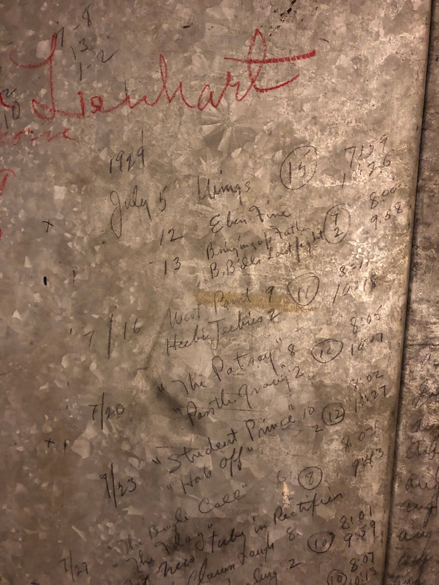 The 1929 film program penciled on the metal wall of the Chautauqua Auditorium projection booth